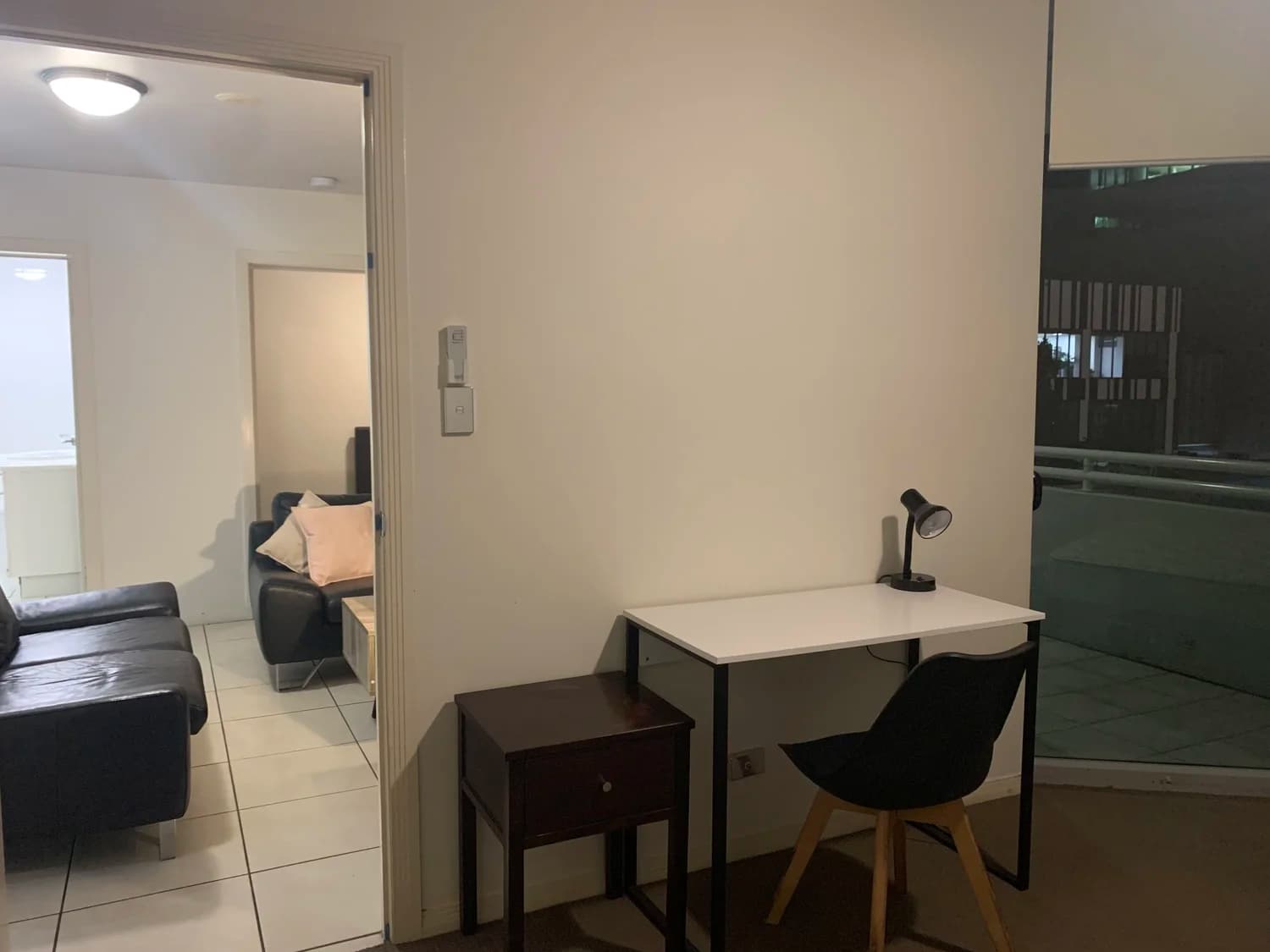 Finishing detail work on Brisbane property — careful attention to surfaces and fixtures